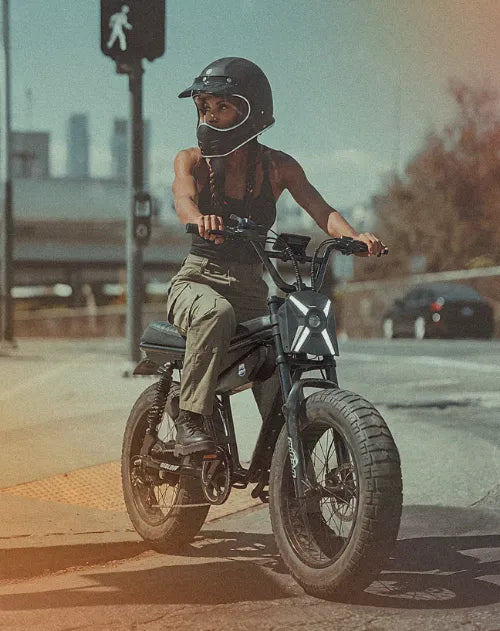 Qiolor NOVA moped-style electric bike in an urban lifestyle setting